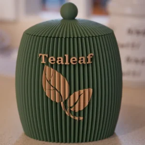 Front view of a green 3D printed tea canister with Tealeaf logo