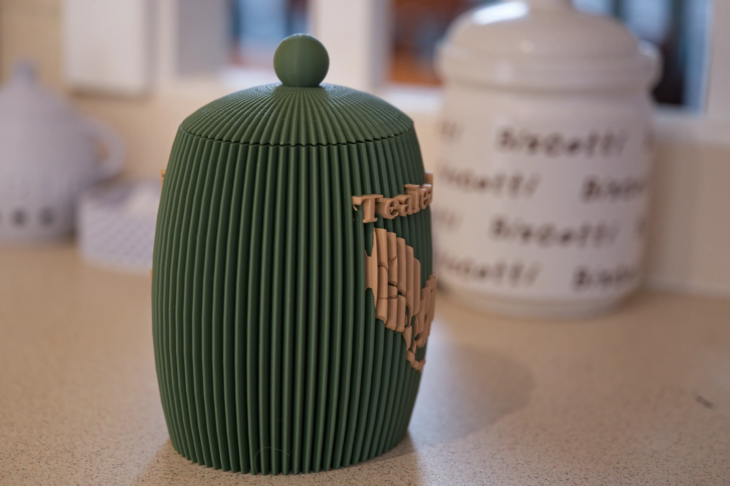 tealeaf-canister-side-profile Side view showing the curved vertical ribbing of the tea jar