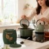 Spooning out tealeaves Tealeaf container with fresh tea ready for spooning out